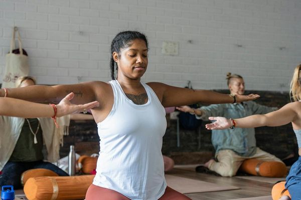 A peaceful setting with a yoga mat and props ready for practice.